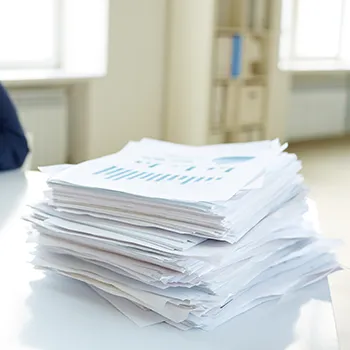 A stack of paper works waiting to be done