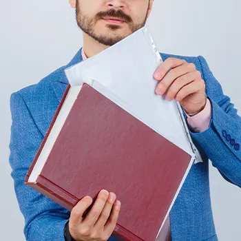 Businessman putting a file inside a folder