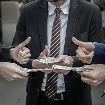 An LLC owner holding cash alongside other workers