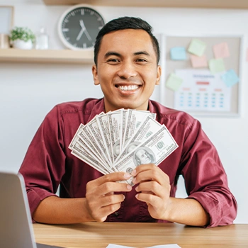 Man showing his individual compensation happily