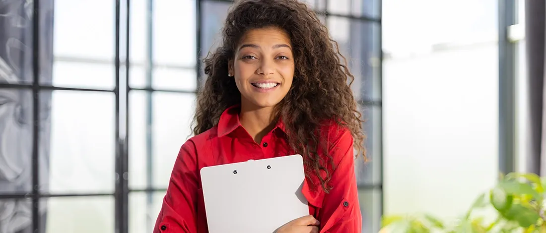 Woman holding a folder about changing a registered agent in Kansas