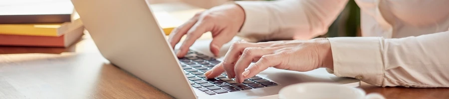 A woman browsing in her laptop