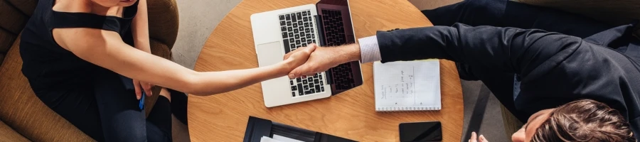 Two people closing a business deal