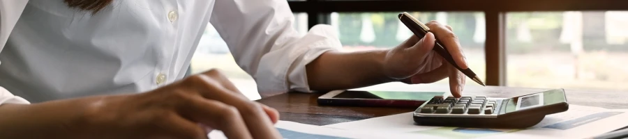 A woman computing business finances