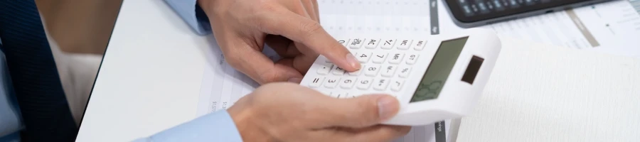 A person computing annual fees and taxes