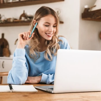 A woman using Zoho Books