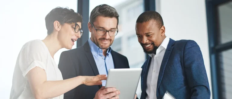 Three people having a chat about how to start a business in New York
