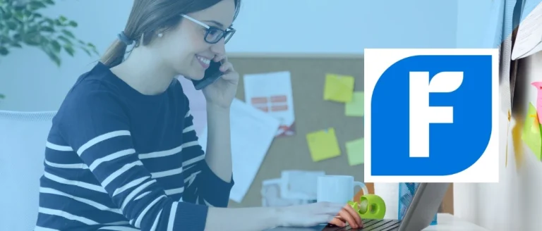 A woman using FreshBooks in her laptop