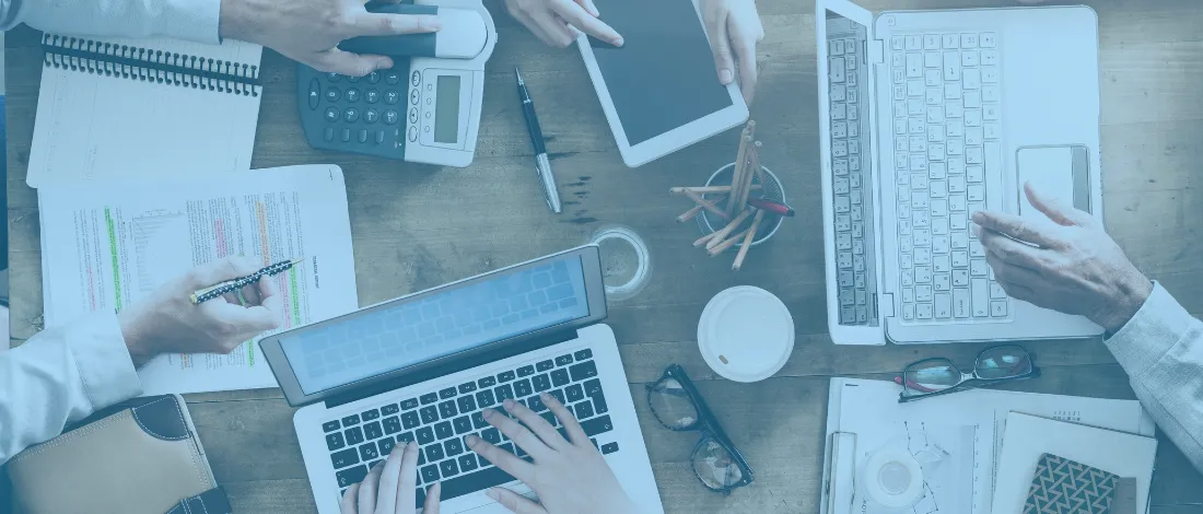 Group of businessmen tracking their business expenses in 2026