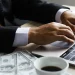Business man computing the cost of an LLC in Arkansas