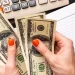 Top view counting money for LLC in West Virginia